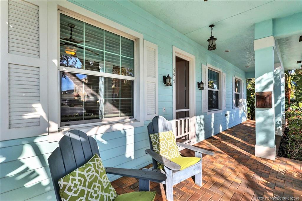 424 Southwest Camden Avenue Stuart, FL 34994 - Photo 5 of 58 a living room with patio furniture and a large window