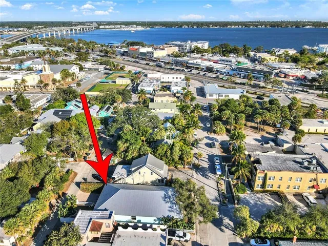an aerial view of residential houses with outdoor space