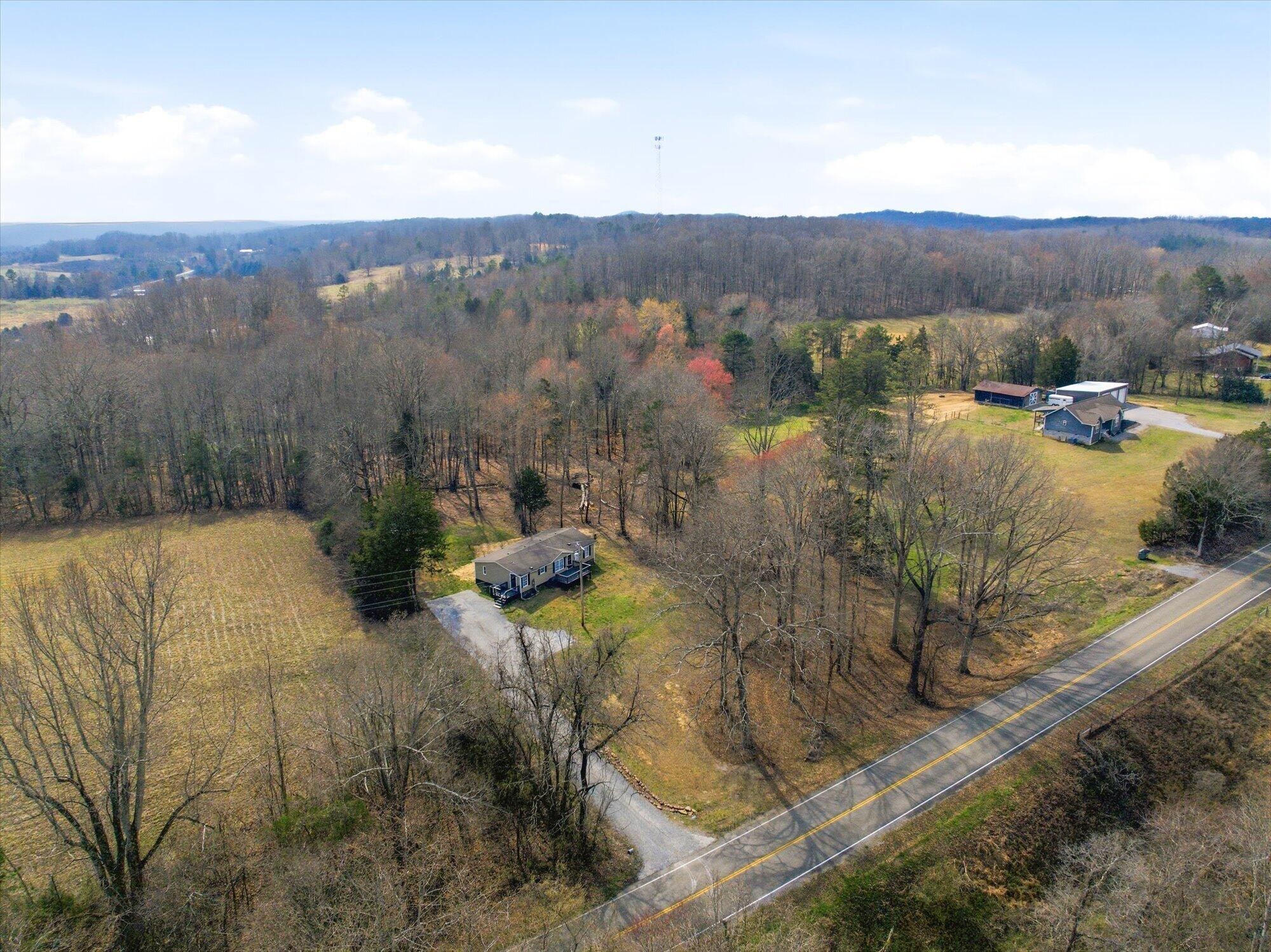 64 County Road 100 Decatur, TN 37322 - Photo 26 of 43 a view of a town with mountains in the background
