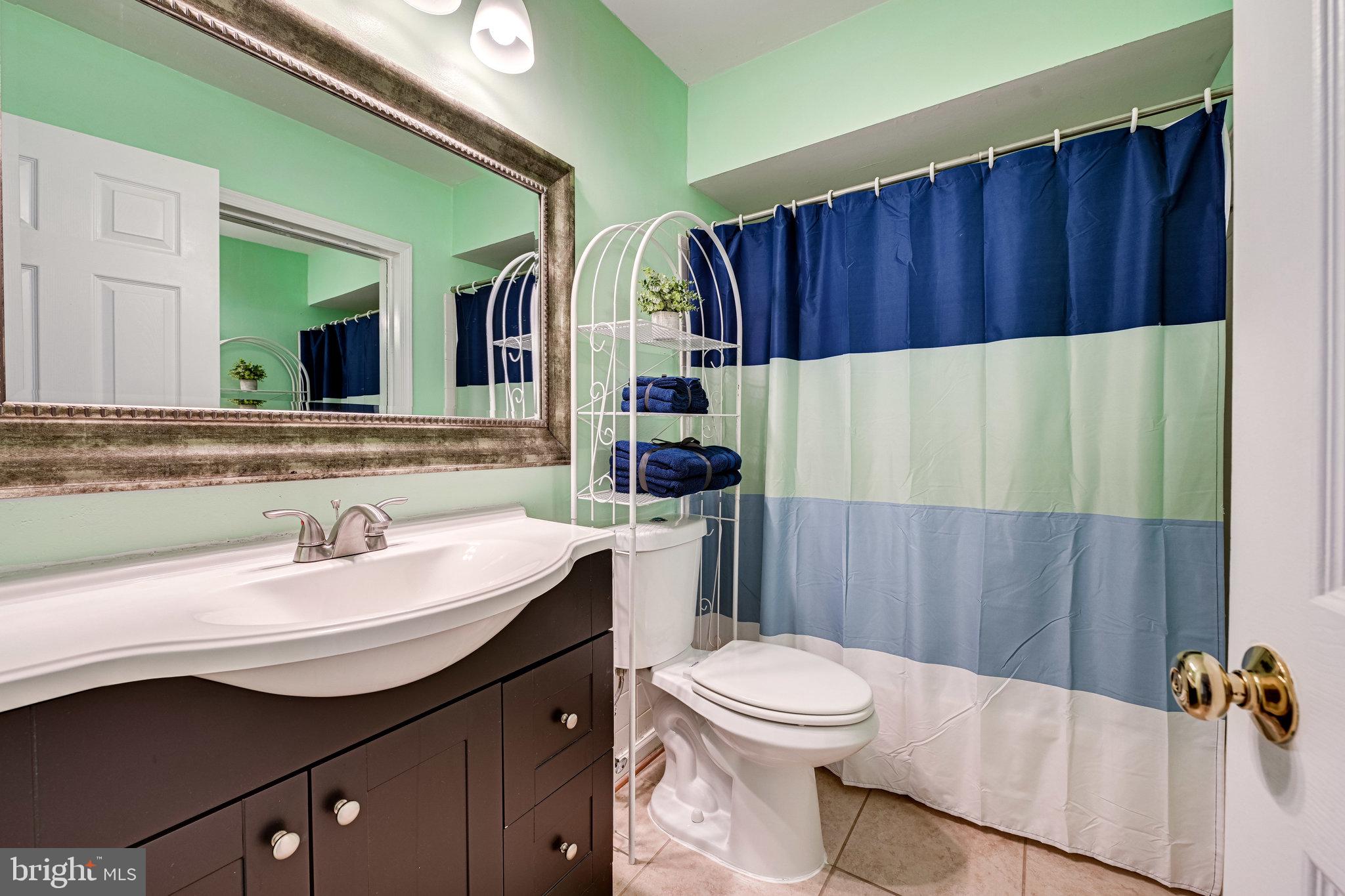 5927 Noblestown Road, Unit 49 Springfield, VA 22152 - Photo 20 of 33 Upper level bath with updated vanity and mirror.