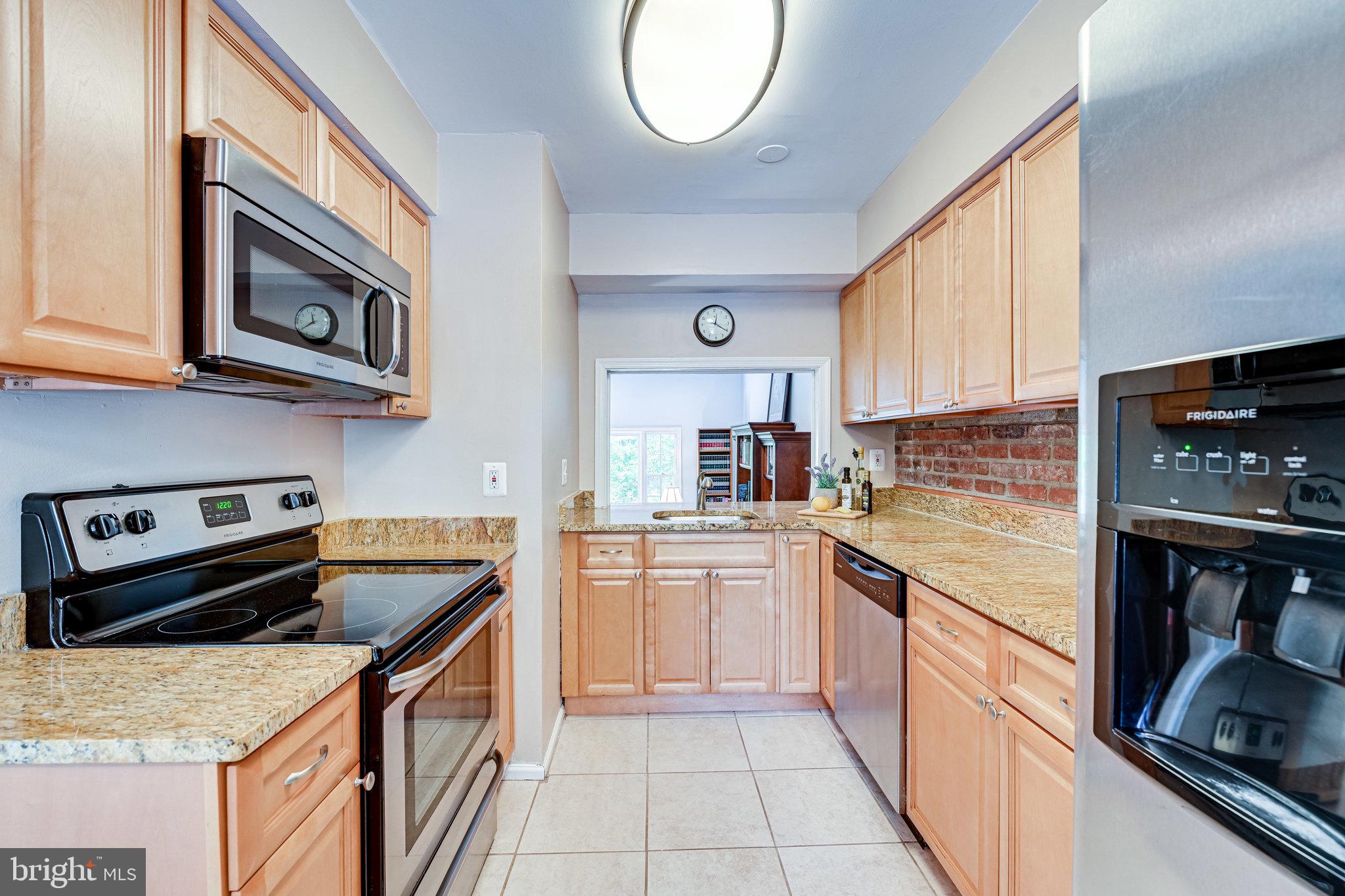 5927 Noblestown Road, Unit 49 Springfield, VA 22152 - Photo 7 of 33 Kitchen has ample cabinet and counter space.