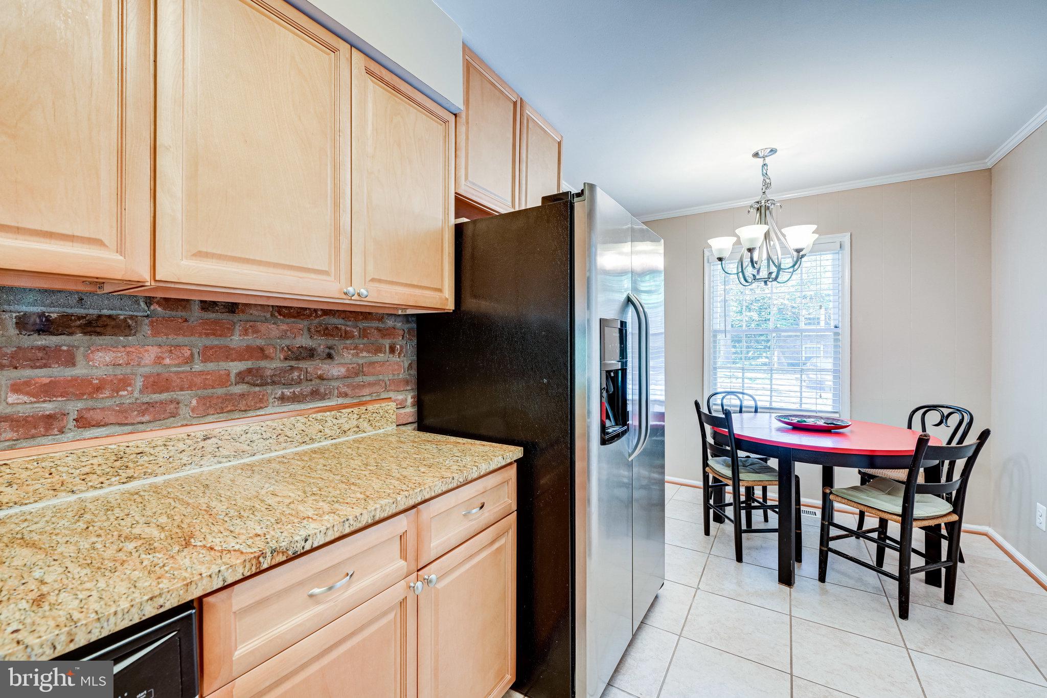 5927 Noblestown Road, Unit 49 Springfield, VA 22152 - Photo 9 of 33 Kitchen with table space overlooking front yard