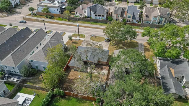 an aerial view of multiple houses with yard