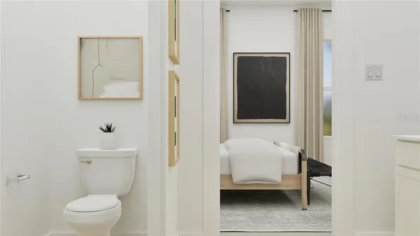 a bathroom with a toilet and a sink