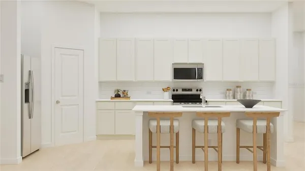 a kitchen with stainless steel appliances granite countertop a stove top oven a sink and dishwasher