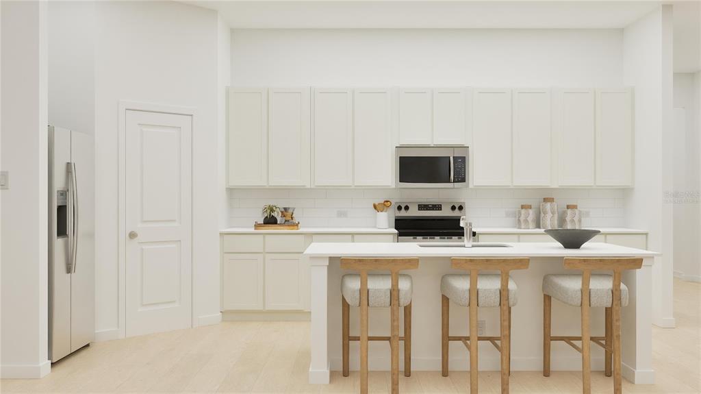 3070 Granite Rdg Avenue Minneola, FL 34715 - Photo 2 of 18 a kitchen with stainless steel appliances granite countertop a stove top oven a sink and dishwasher