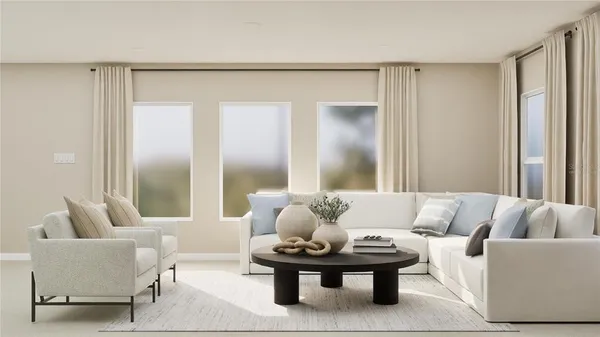 a living room with furniture and white walls