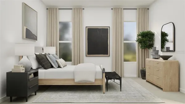 a bedroom with furniture and a window