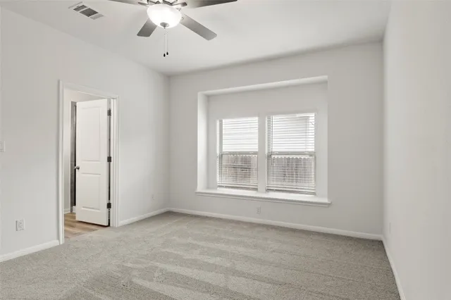 a kitchen with lots of counter top space and windows