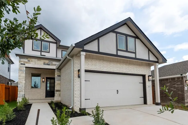 a front view of house with a yard