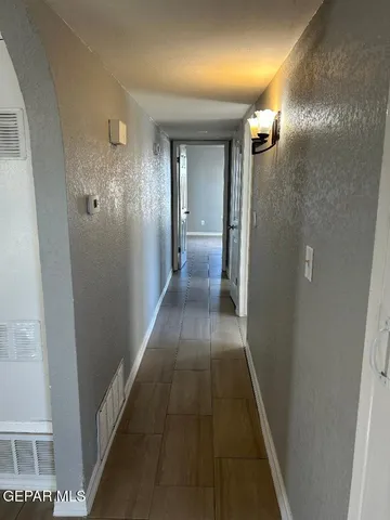 a bathroom with a bathtub a window and a shower