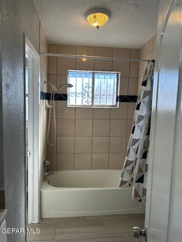 a bathroom with a sink mirror and vanity