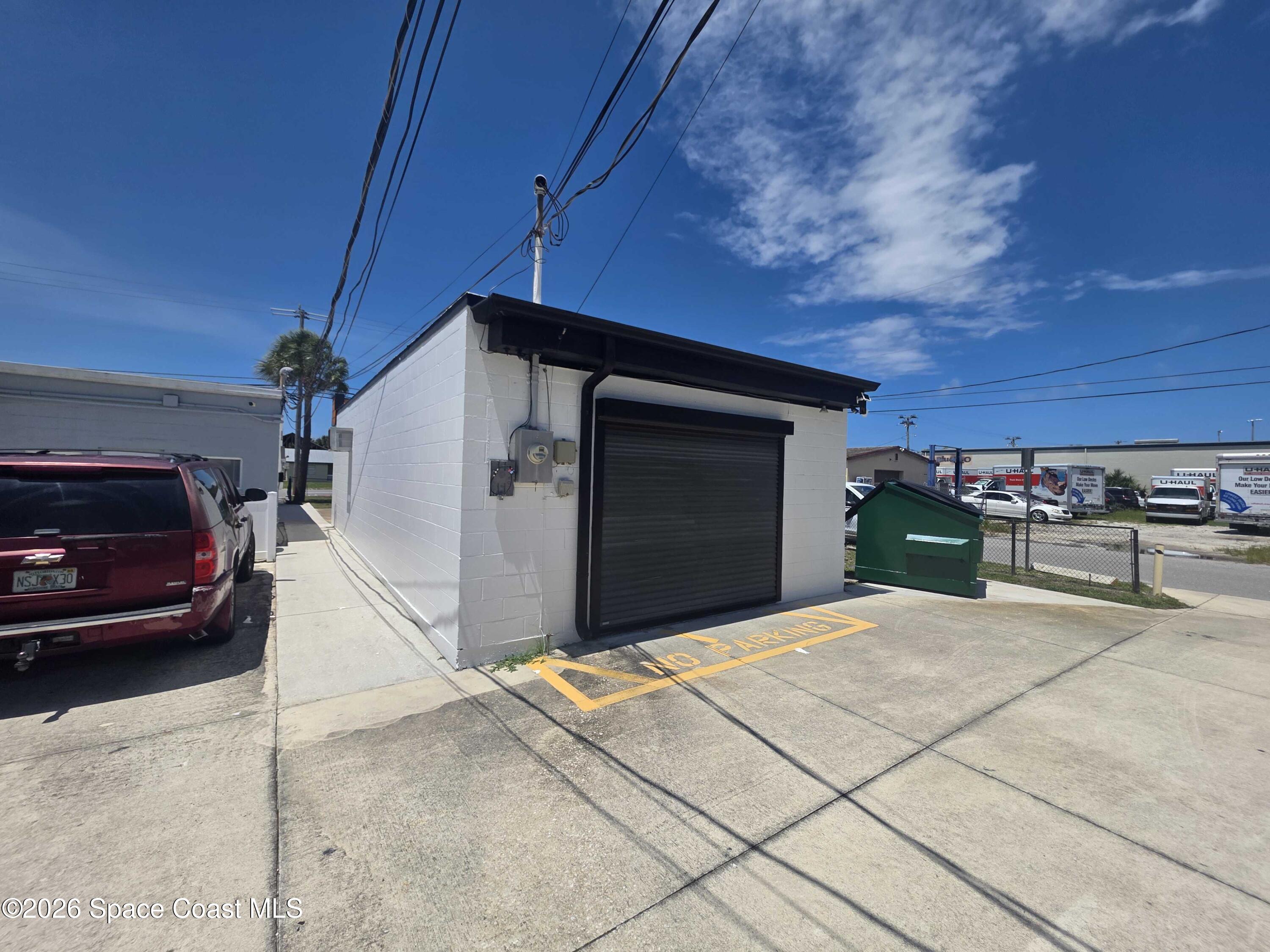 1777 Aurora Road Melbourne, FL 32935 - Photo 3 of 6 a view of garage with cars