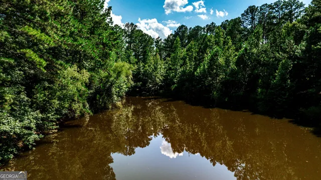 a view of lake from inside of house