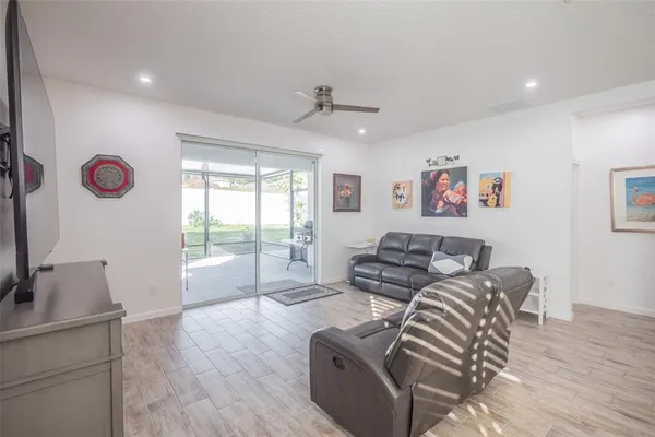 a living room with furniture and a window
