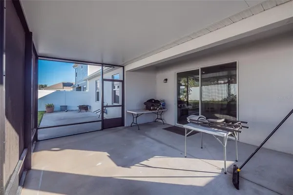 a bedroom with furniture and large window