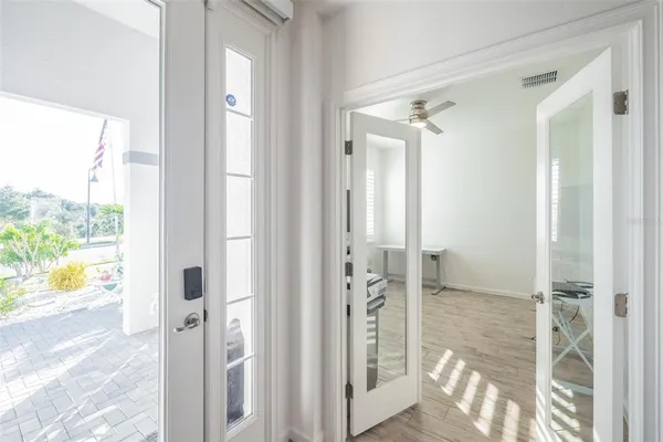 a bathroom with a glass shower door and a glass door