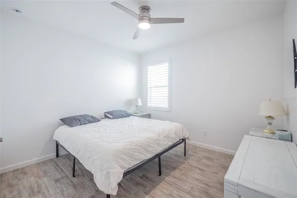 a bedroom with a bed and a table in it