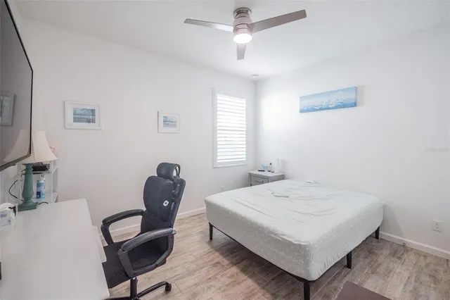 a bedroom with a bed and a chair