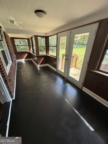 a view of an entryway with a floor to ceiling window