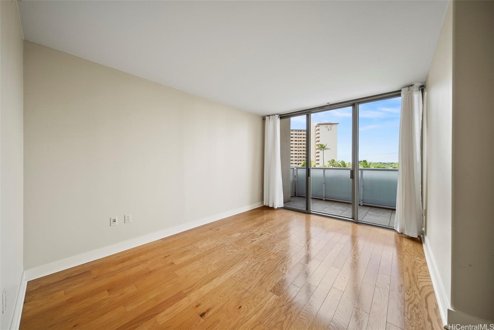 1551 Ala Wai Boulevard, Unit 504 Honolulu, HI 96815 - Photo 13 of 25 wooden floor in an empty room with a window