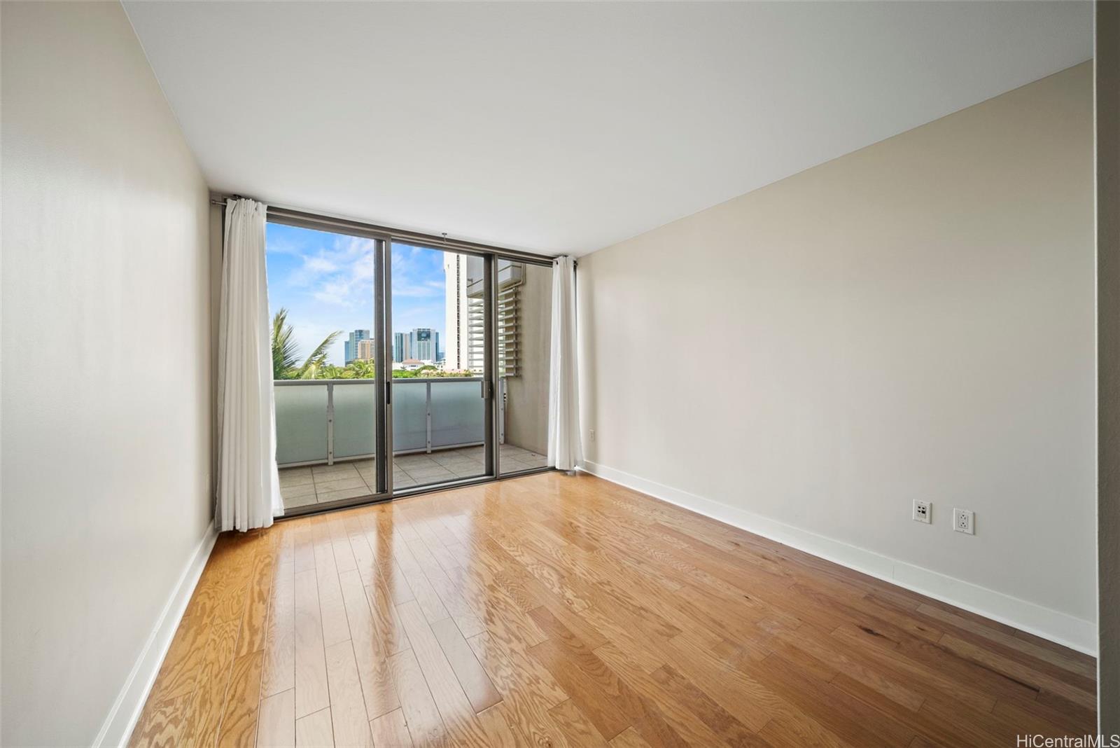 1551 Ala Wai Boulevard, Unit 504 Honolulu, HI 96815 - Photo 18 of 25 a view of an empty room and wooden floor