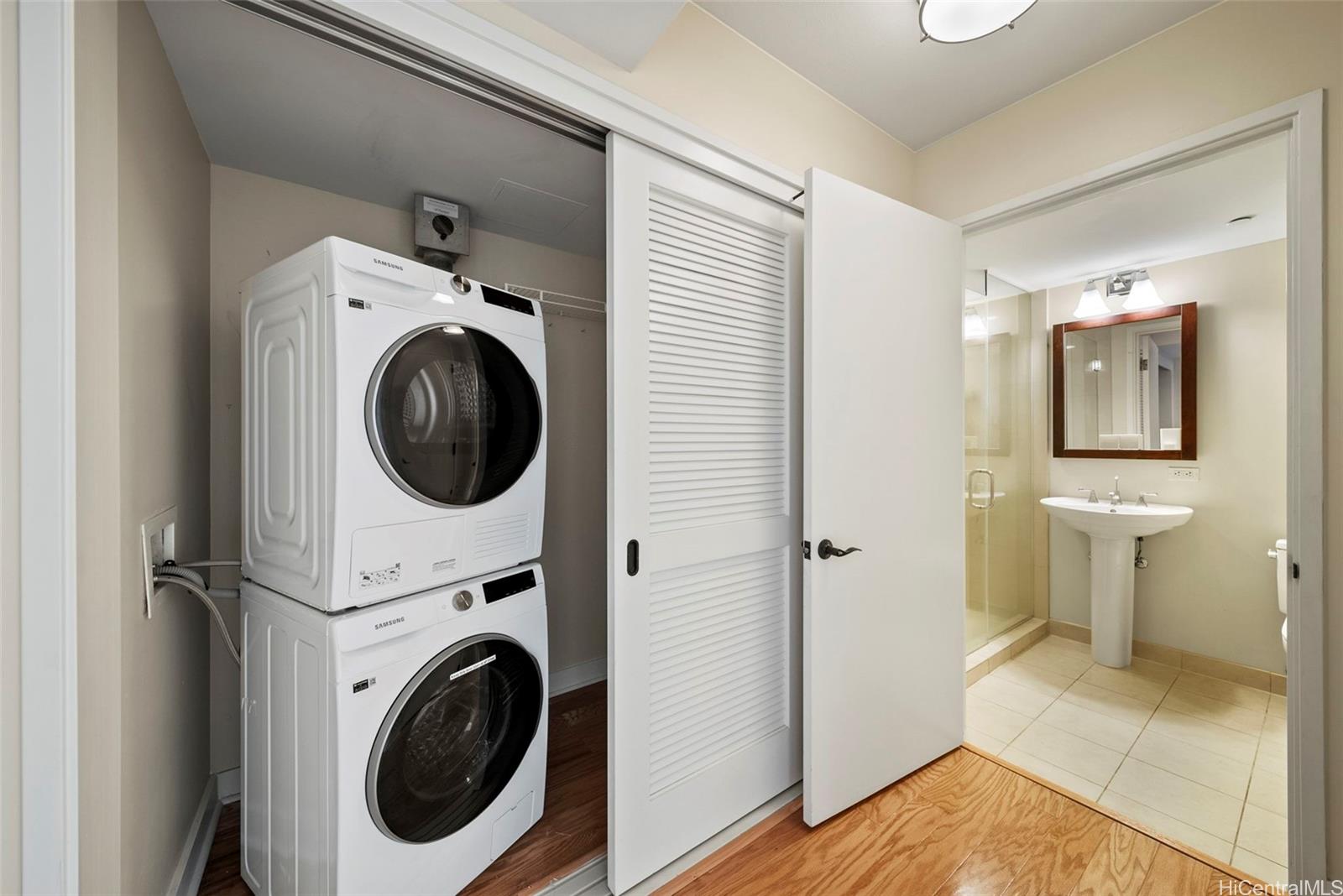 1551 Ala Wai Boulevard, Unit 504 Honolulu, HI 96815 - Photo 22 of 25 a view of a hallway with washer and dryer