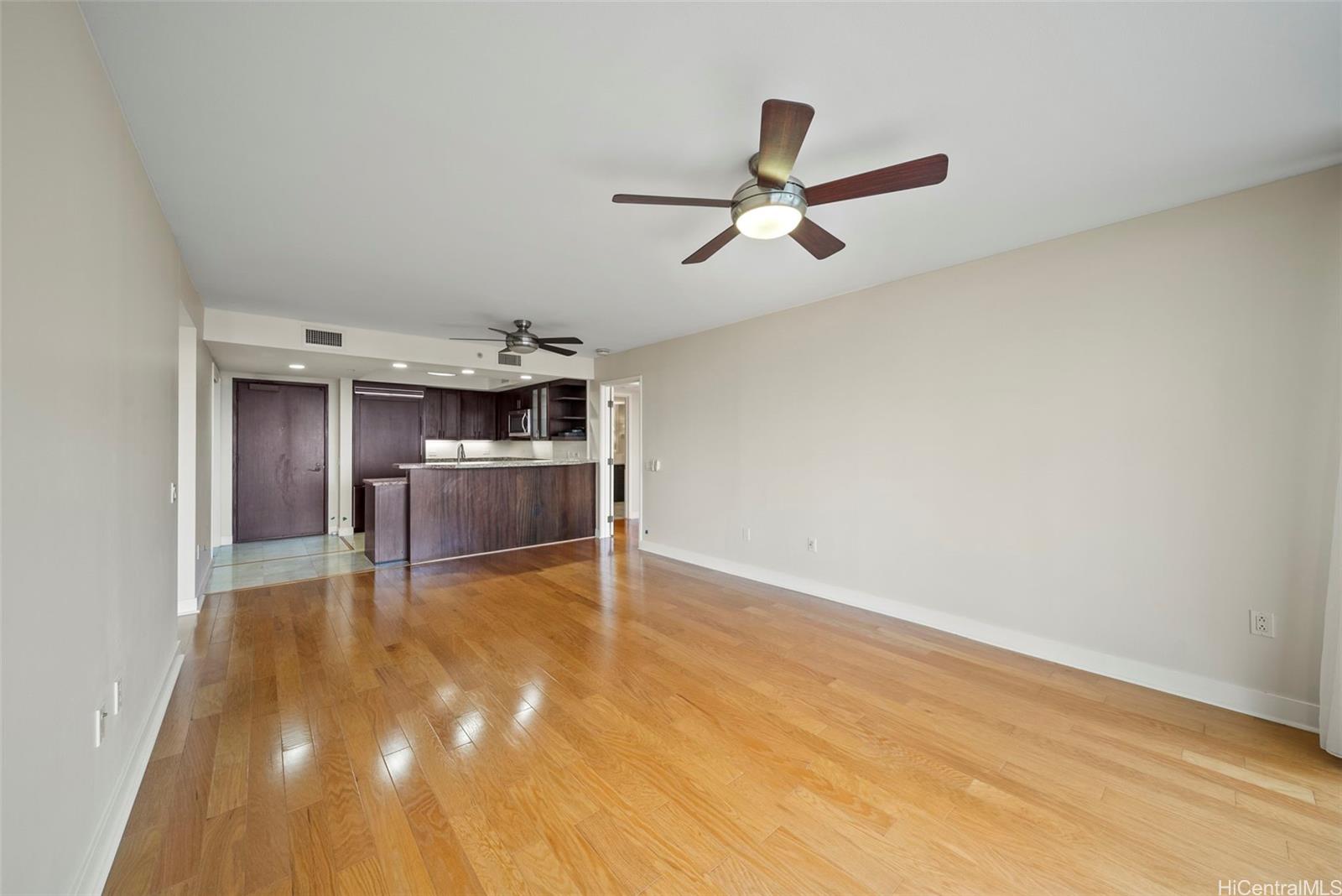 1551 Ala Wai Boulevard, Unit 504 Honolulu, HI 96815 - Photo 7 of 25 a view of empty room with wooden floor and window