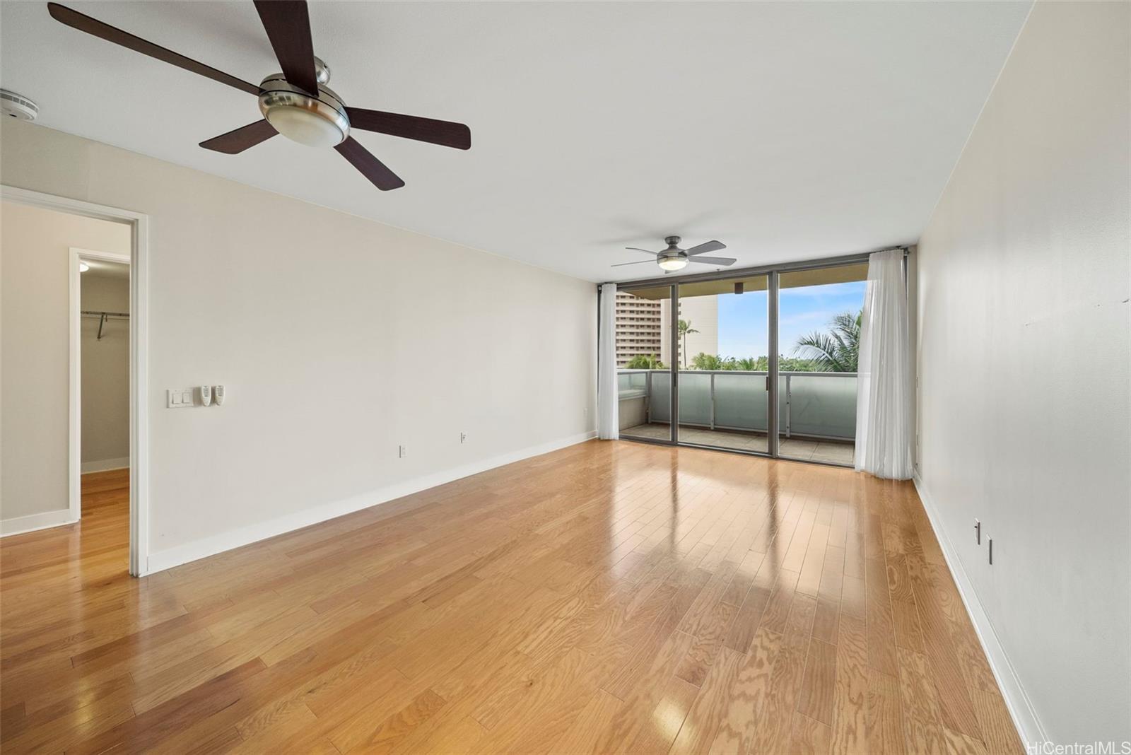 1551 Ala Wai Boulevard, Unit 504 Honolulu, HI 96815 - Photo 8 of 25 wooden floor in an empty room with a window