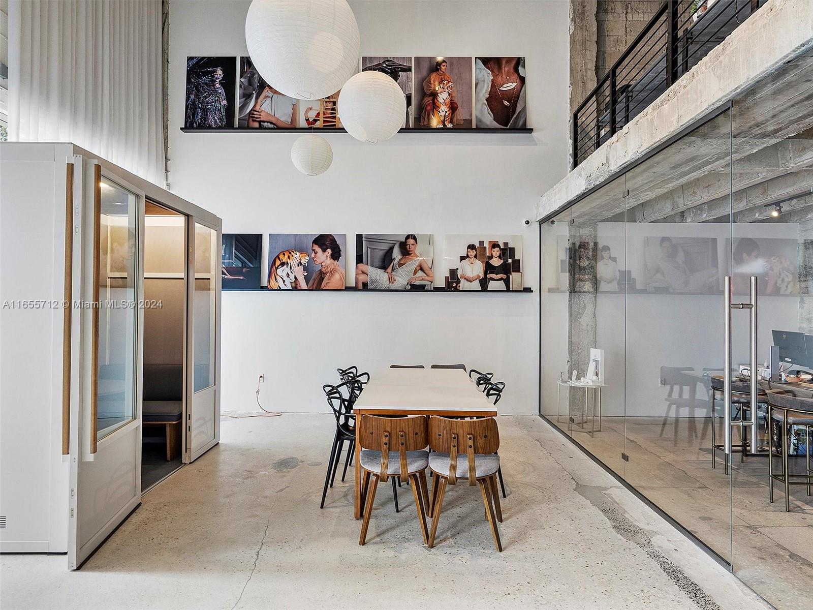 8101 Biscayne Boulevard, Unit C3 Miami, FL 33138 - Photo 14 of 25 a dining room with furniture and a kitchen view