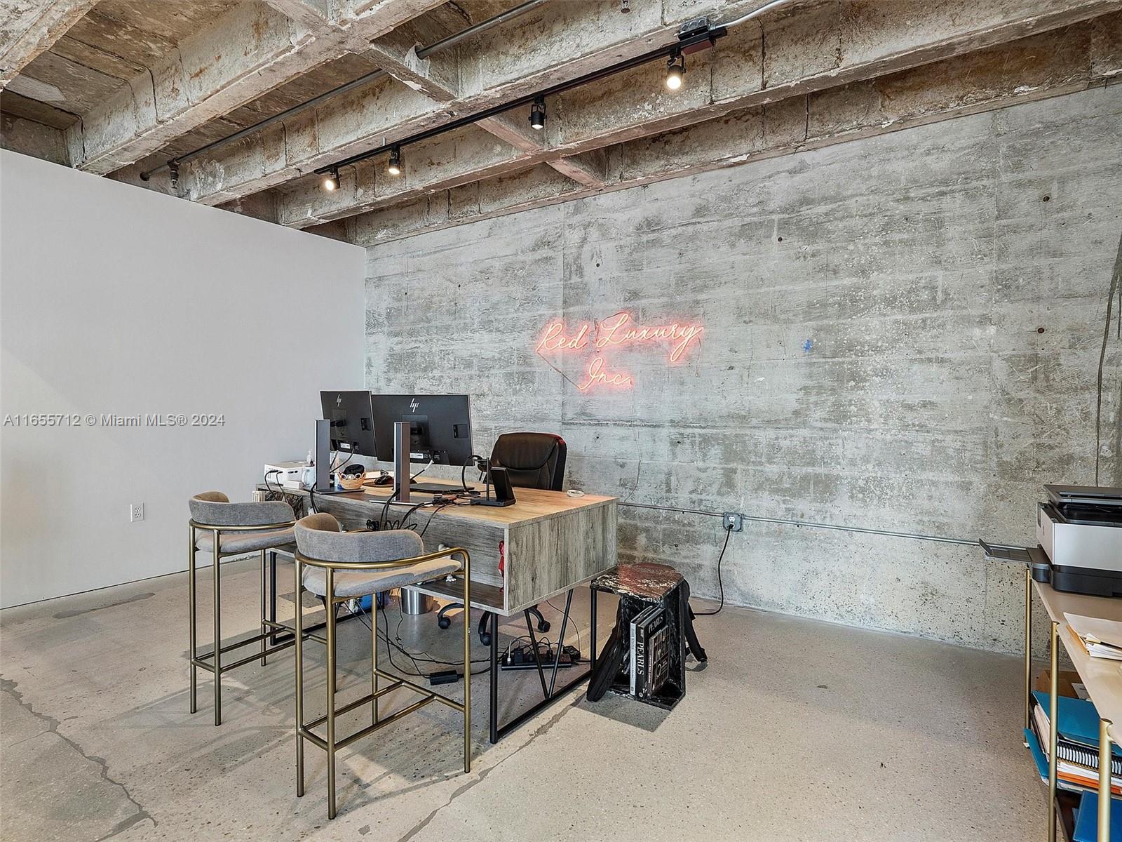 8101 Biscayne Boulevard, Unit C3 Miami, FL 33138 - Photo 24 of 25 a view of a room with chairs and a table