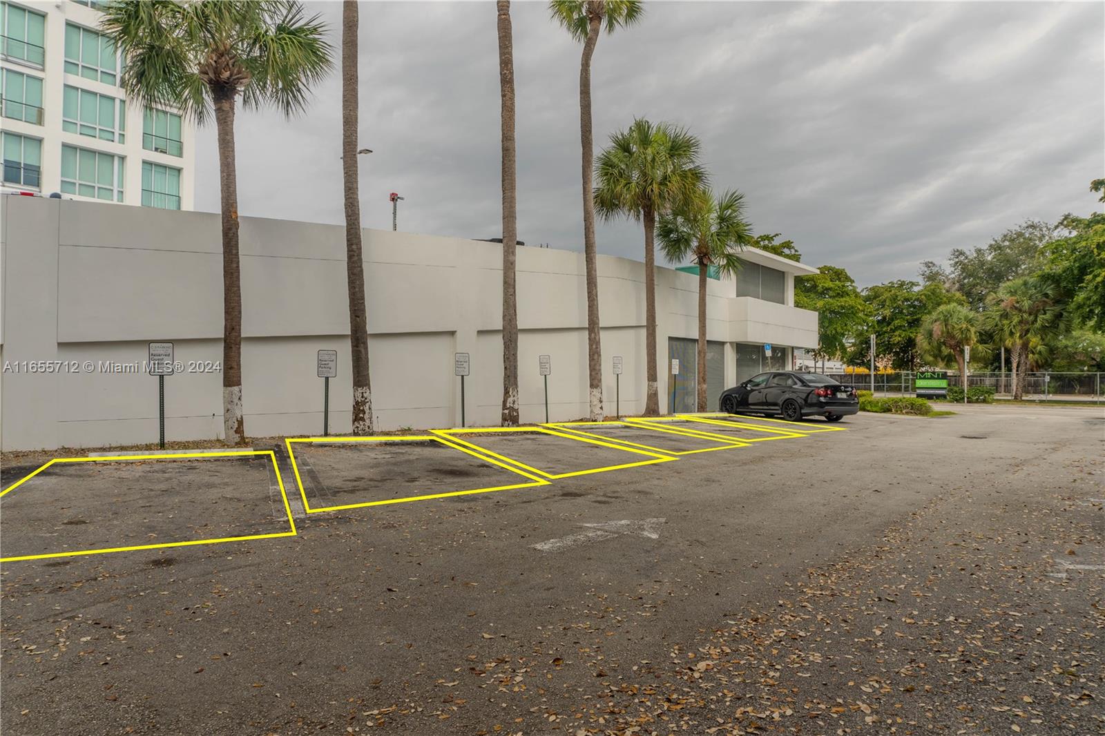 8101 Biscayne Boulevard, Unit C3 Miami, FL 33138 - Photo 4 of 25 a swimming pool with a yard and palm trees