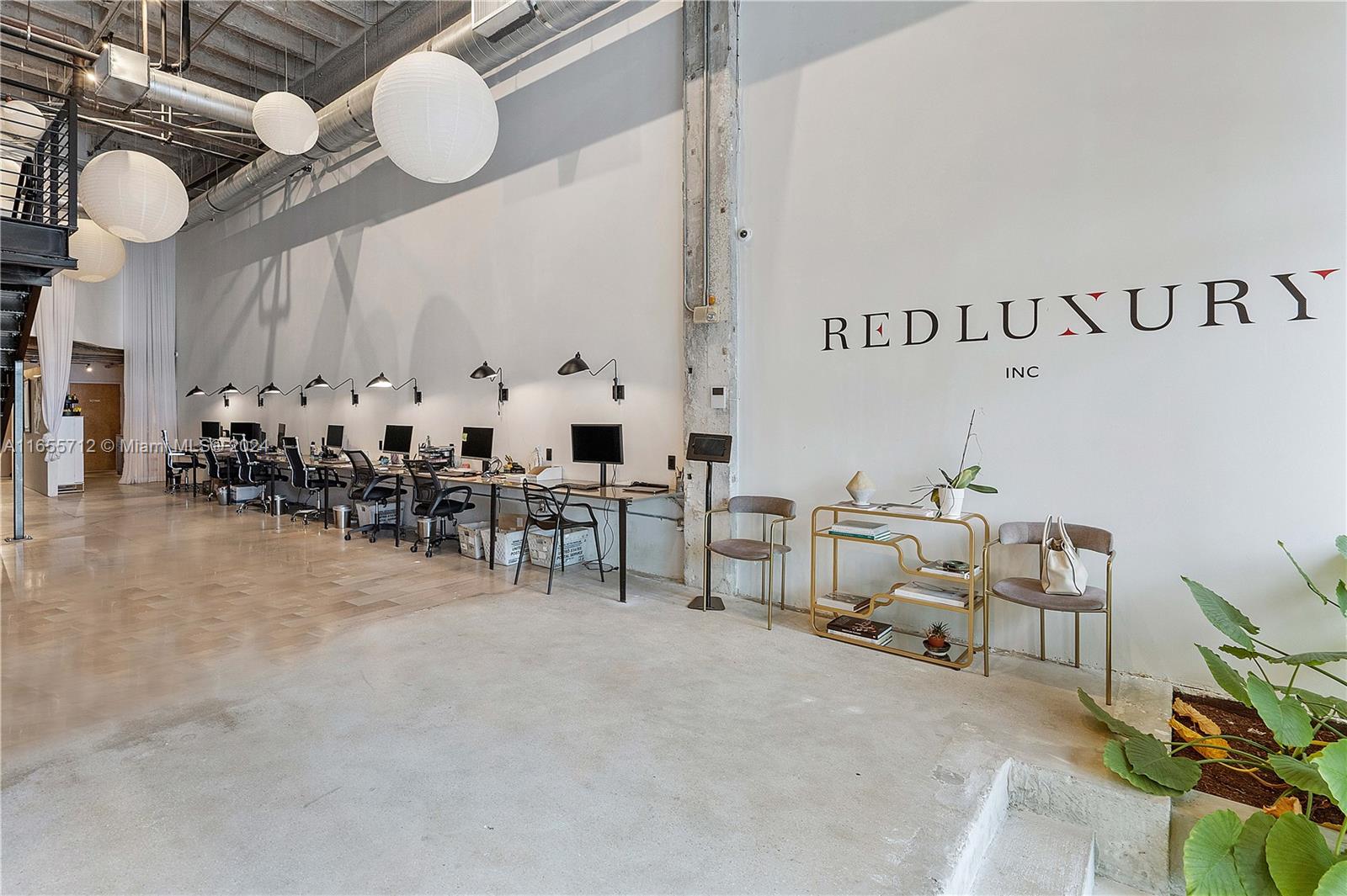 8101 Biscayne Boulevard, Unit C3 Miami, FL 33138 - Photo 10 of 25 a room with lots of white furniture and a painting on the wall