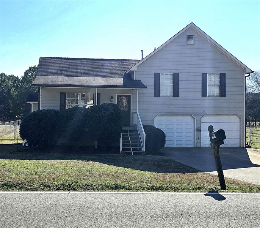 961 Sugar Valley Road Southwest Cartersville, GA 30120 - Photo 1 of 1 a front view of a house with a yard