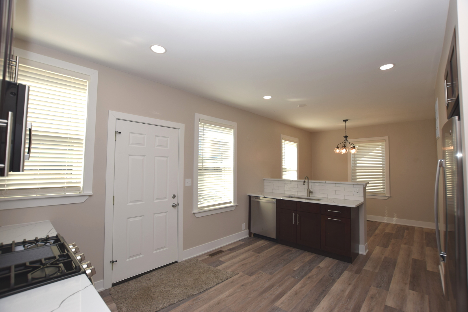 97 Gates Street Crystal Lake, IL 60014 - Photo 5 of 22 a kitchen with granite countertop a sink and a stove top oven