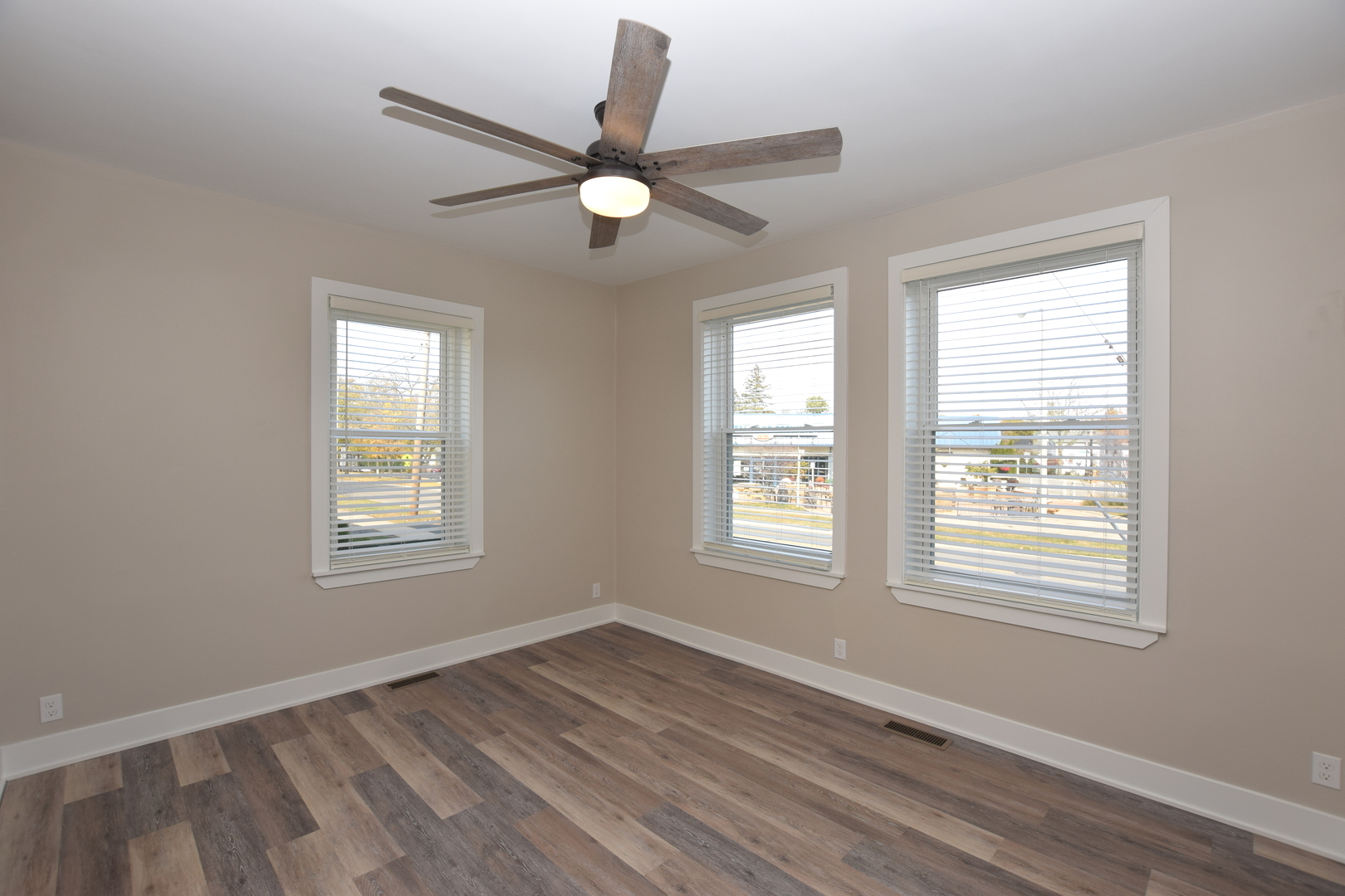 97 Gates Street Crystal Lake, IL 60014 - Photo 9 of 22 a view of an empty room with wooden floor and a window