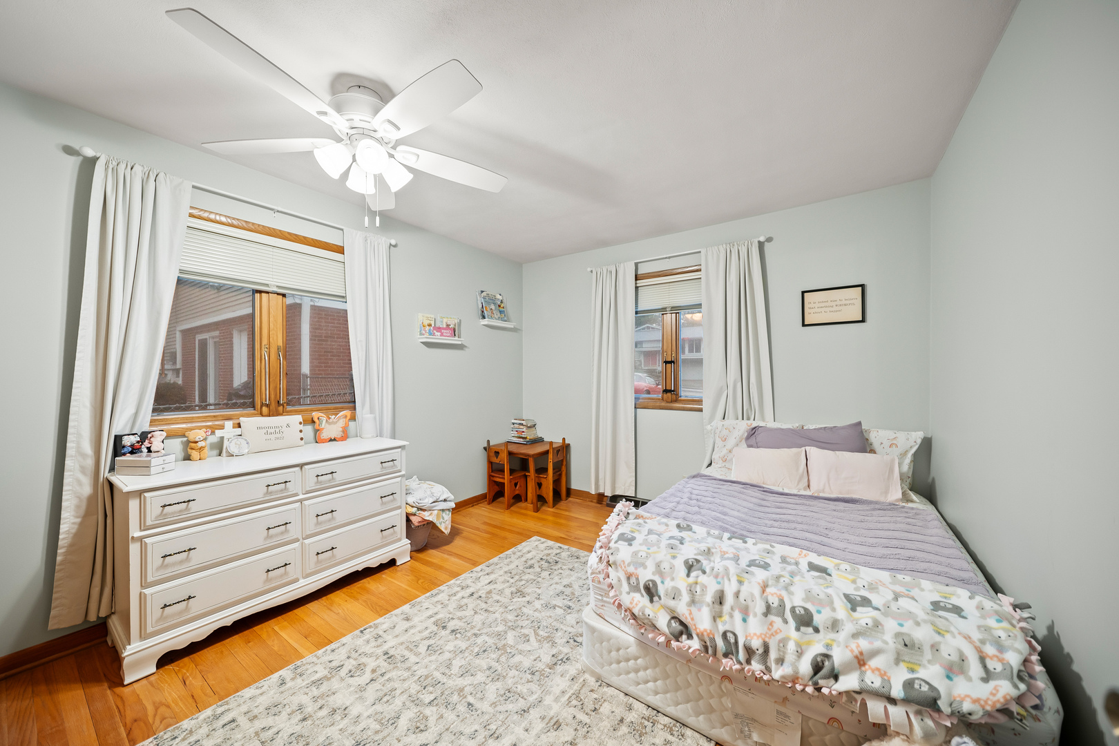 3138 12th Avenue Moline, IL 61265 - Photo 16 of 34 a bedroom with a bed and a chandelier