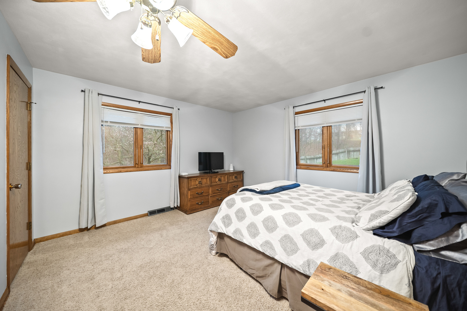 3138 12th Avenue Moline, IL 61265 - Photo 17 of 34 a bedroom with a large bed and a window