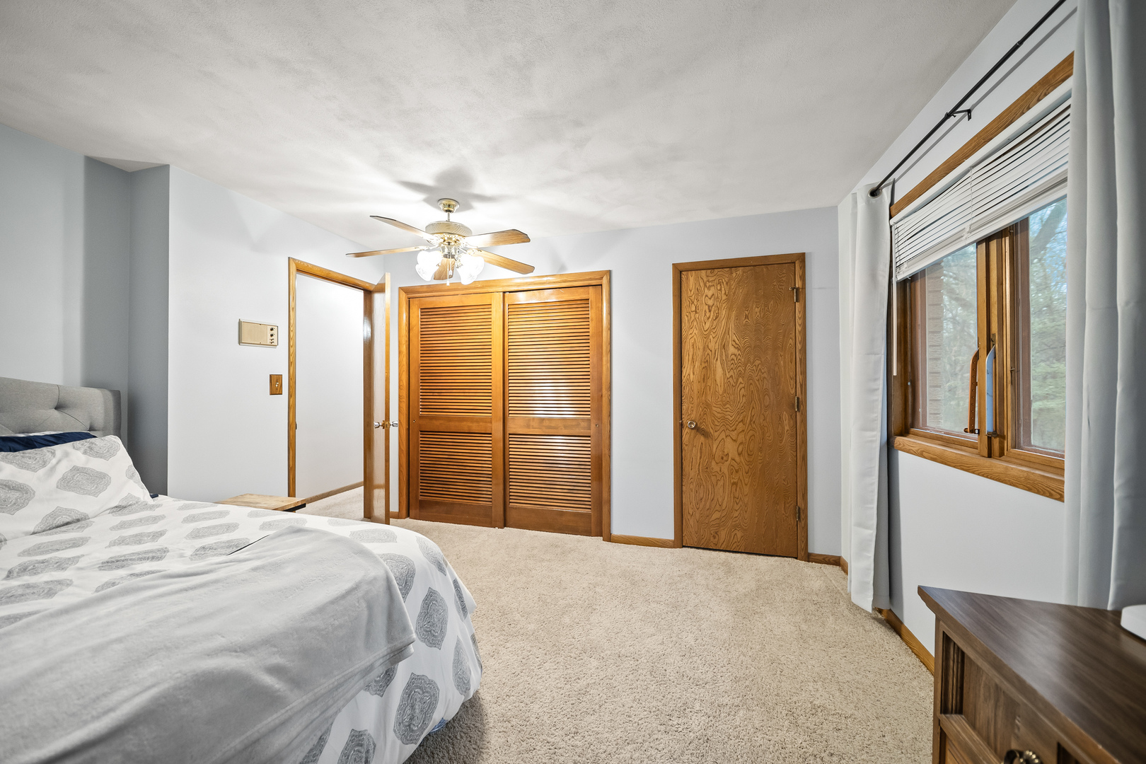 3138 12th Avenue Moline, IL 61265 - Photo 19 of 34 a bedroom with a bed and a chandelier