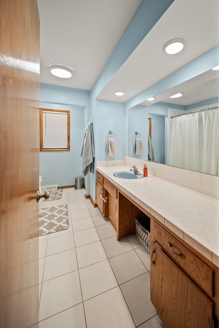 3138 12th Avenue Moline, IL 61265 - Photo 20 of 34 a large white kitchen with a sink and washing machine