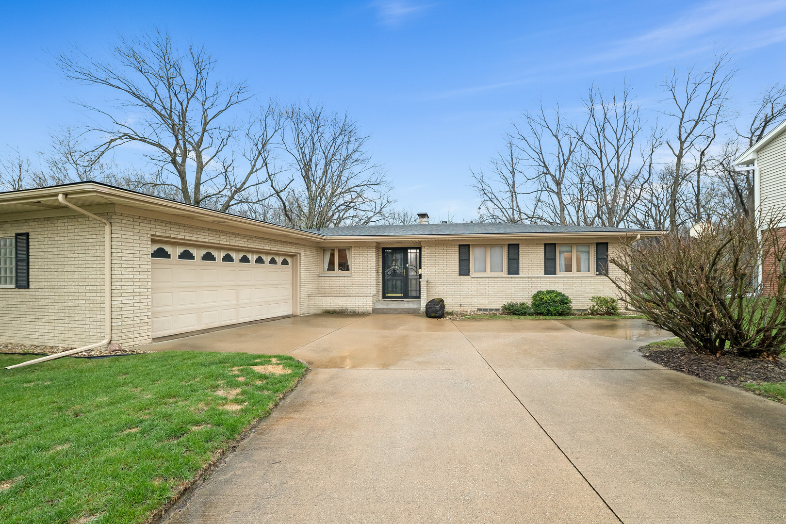 3138 12th Avenue Moline, IL 61265 - Photo 2 of 34 a front view of a house with a yard and garage