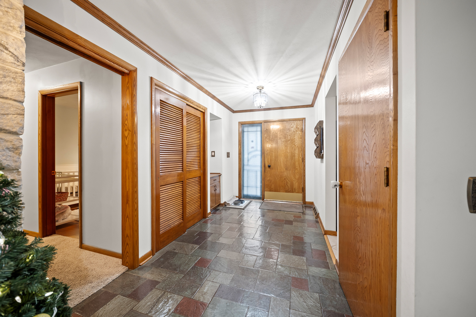 3138 12th Avenue Moline, IL 61265 - Photo 6 of 34 a view of a hallway with wooden shelves