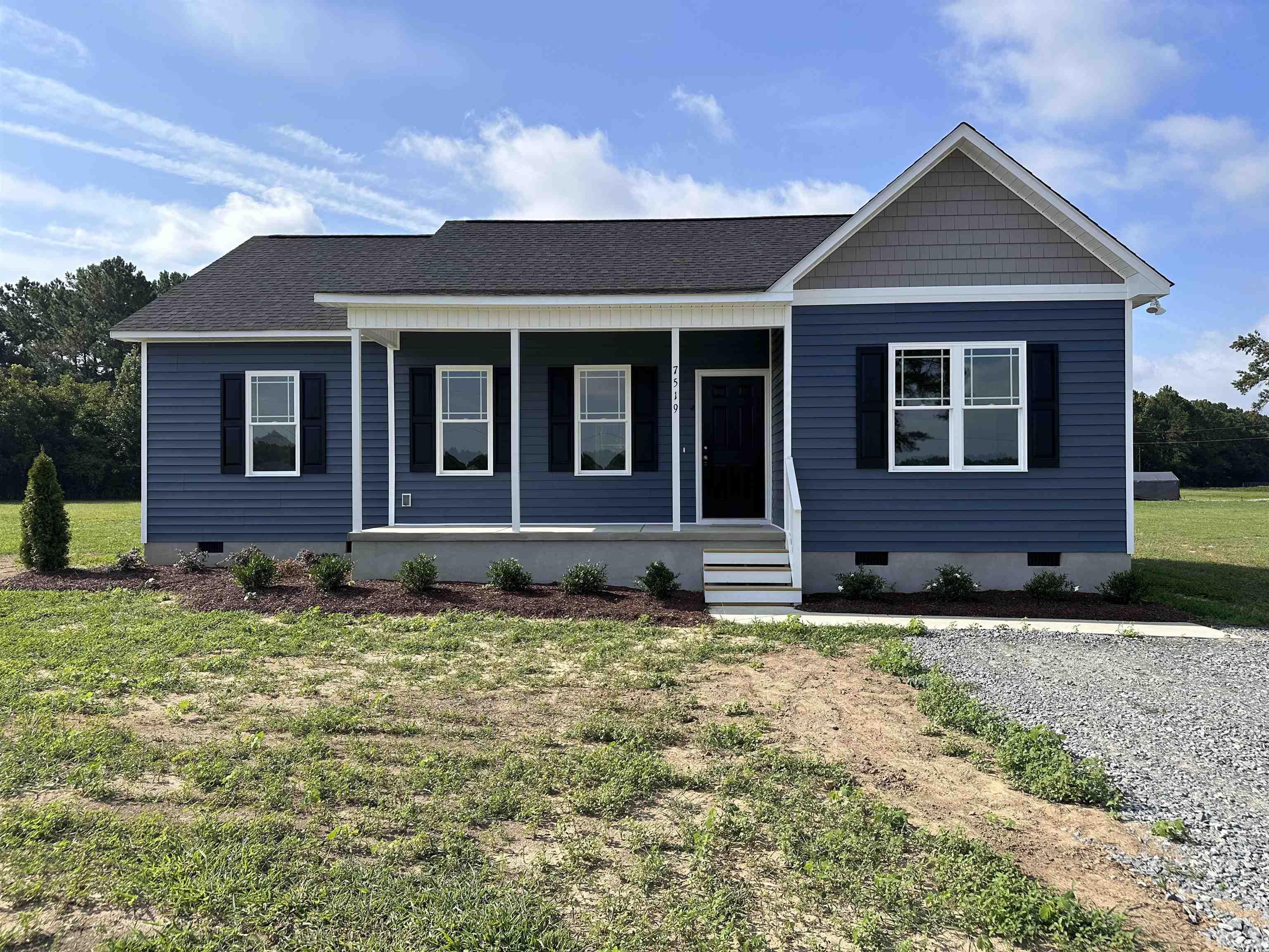 7519 Springfield School Road Lucama, NC 27851 - Photo 1 of 8 a front view of a house with a yard