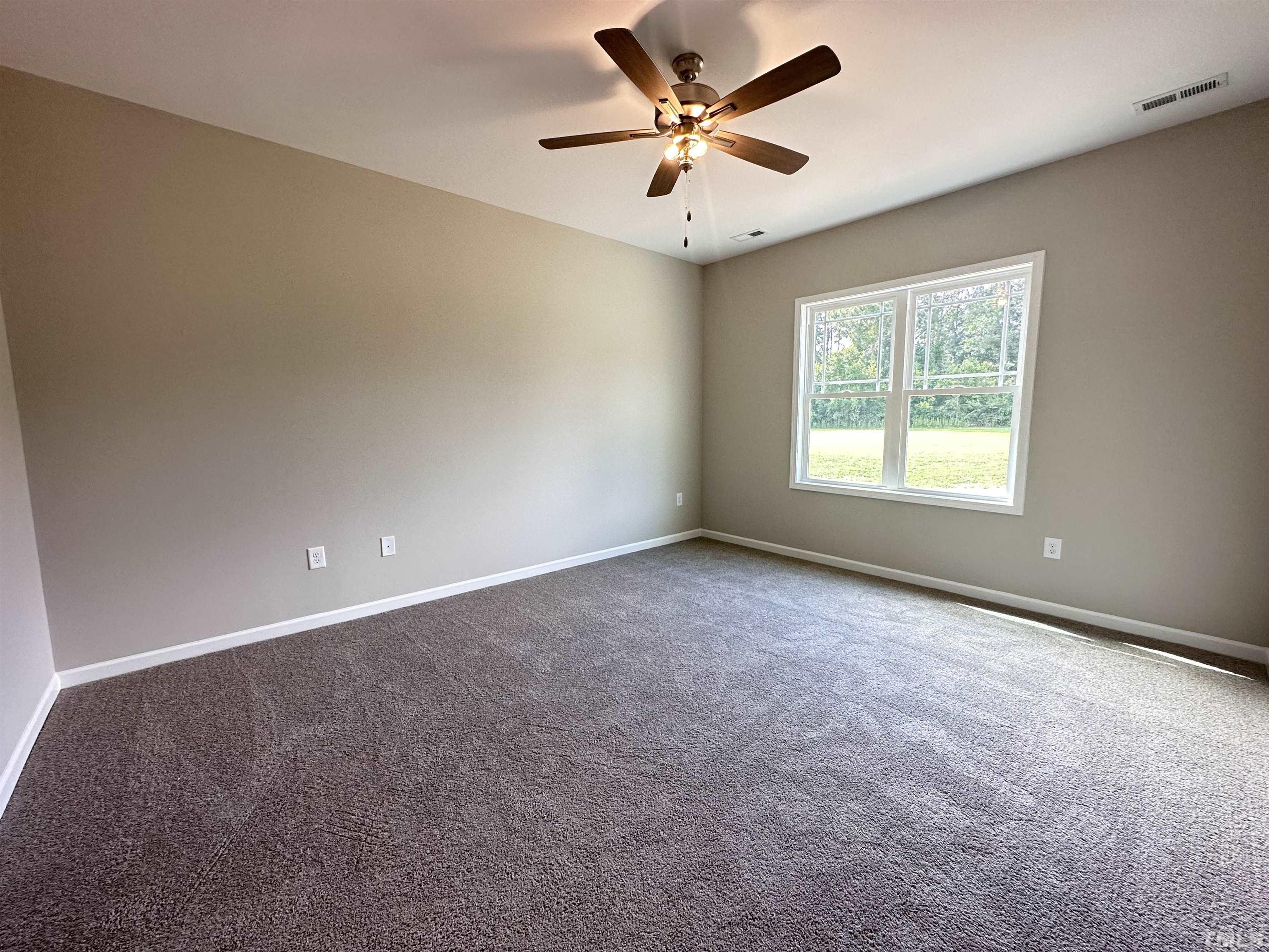 7519 Springfield School Road Lucama, NC 27851 - Photo 4 of 8 an empty room with a window