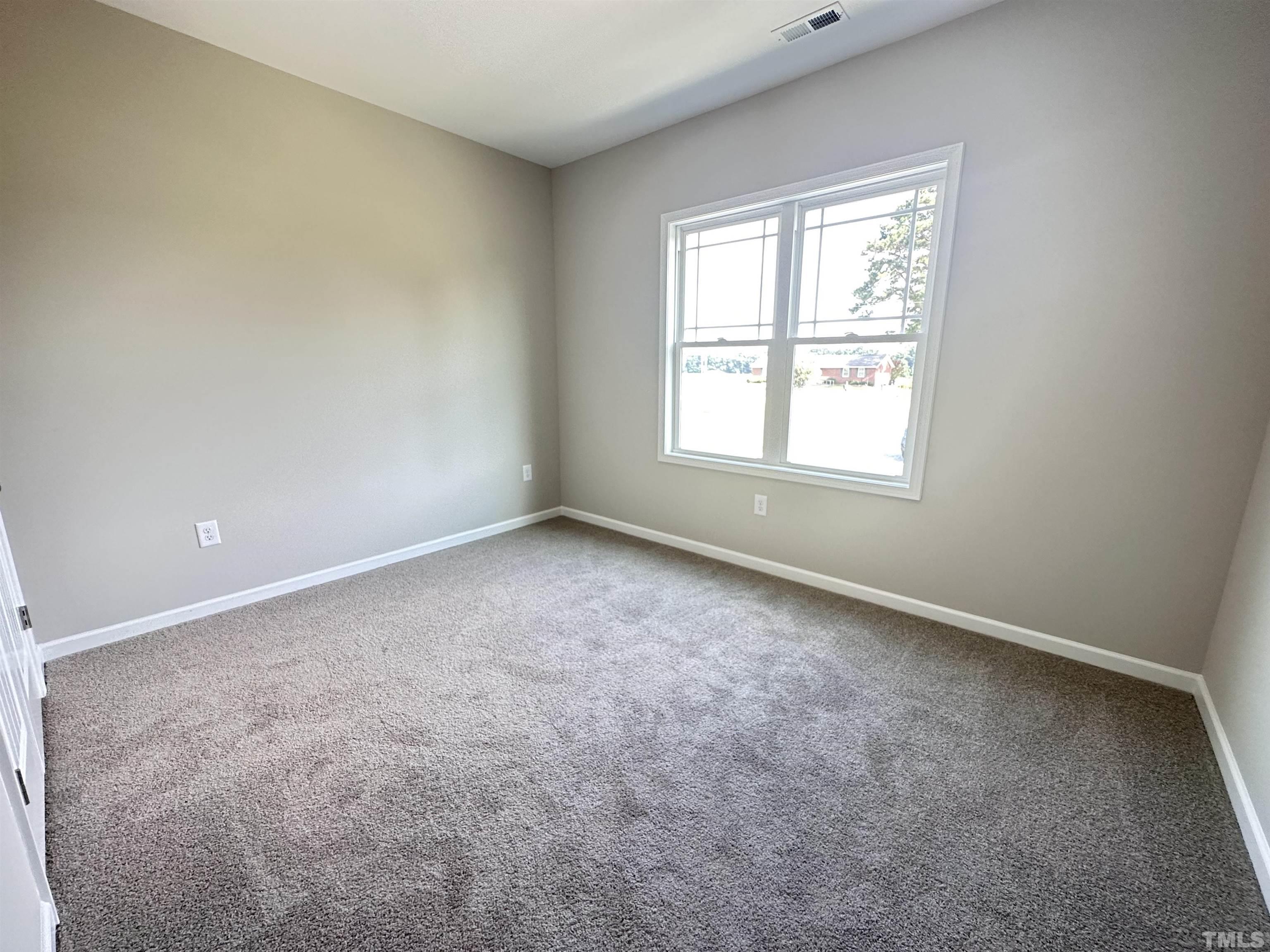 7519 Springfield School Road Lucama, NC 27851 - Photo 6 of 8 an empty room with a window
