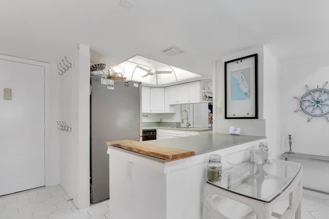 a view of living room with granite countertop furniture and fireplace