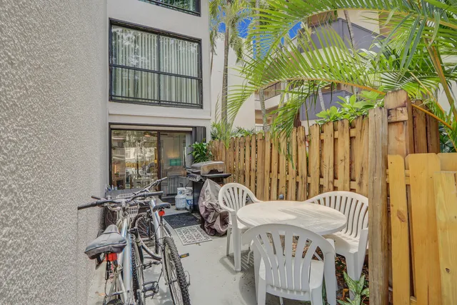 a view of balcony with two chairs and a table