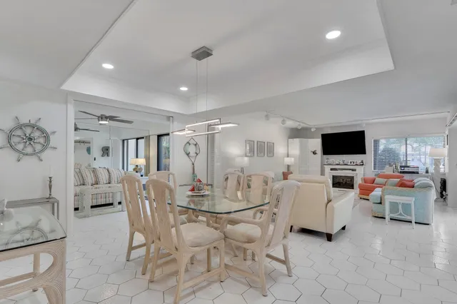 a view of a livingroom with furniture and a flat screen tv
