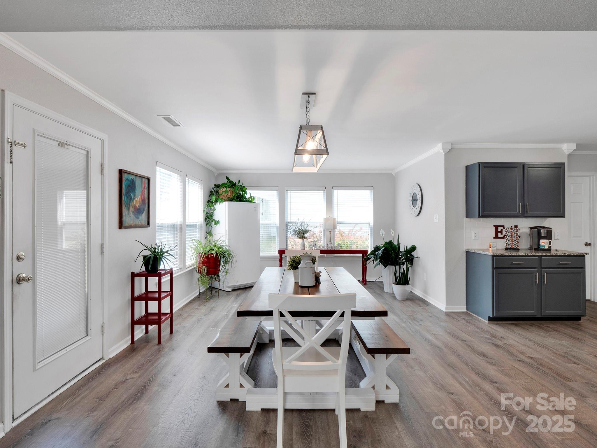 4148 Shasta Circle Clover, SC 29710 - Photo 15 of 48 a living room with furniture a flat screen tv and wooden floor