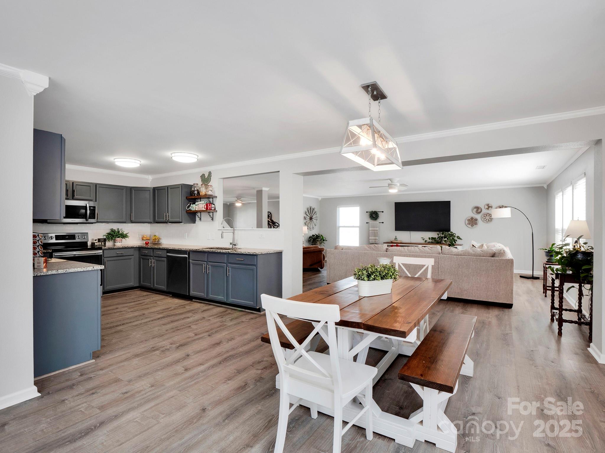4148 Shasta Circle Clover, SC 29710 - Photo 16 of 48 a living room with furniture kitchen view and a chandelier
